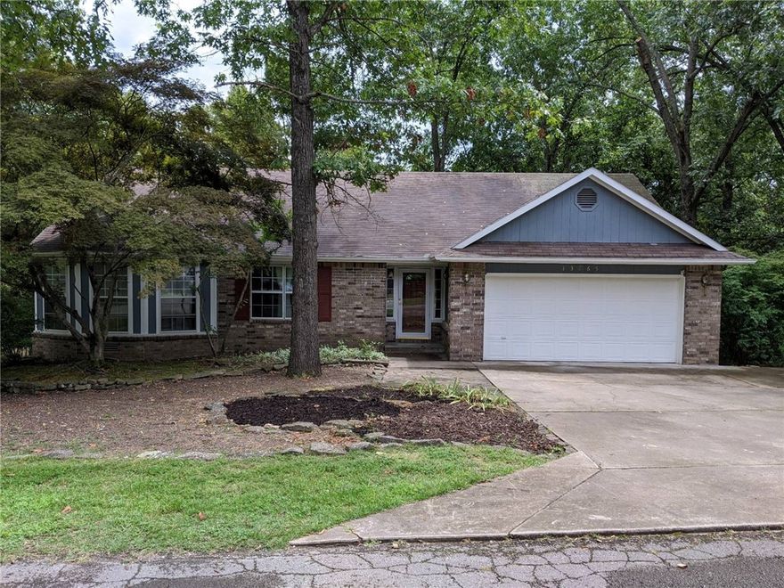 Awesome setting near Beaver Lake!!! Gorgeous home in the Dream Valley Subdivision. Features include 3 bedrooms, 2 1/2 baths. Downstairs bonus/office/game room with 1/2 bath. Could serve as 4th bedroom. Huge master suite with his/hers walk in closets. Laminate plank flooring throughout. Storage shed, huge deck overlooking wooded area. Fire pit to relax in the cool evenings. Minutes from Prairie Creek Marina.