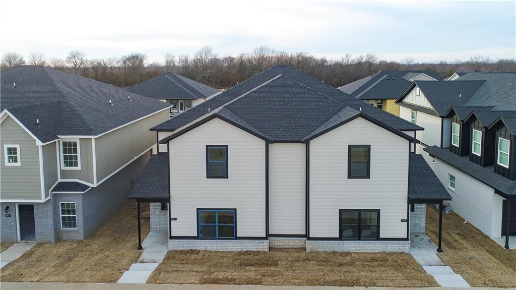 **Available now through June 2025 for a short term lease** Newer 4 bedroom, 4.5 bathroom duplex located in a fast growing area of Fayetteville with a bike trail at your front door. This unit has granite countertops, a private balcony, and an open-floor concept with high-end appliances.