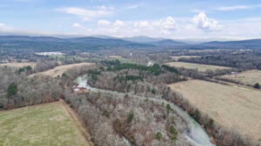 This 369+/- acre cattle farm in Scott County, AR, offers prime pastureland with excellent grass, making it ideal for livestock. The property is fenced and cross-fenced, ensuring efficient grazing management. A newly remodeled 1,344 sq ft residence provides comfortable living, while a hay barn, working pens, and catch pens add to the farm's functionality. With Fourche LaFave River frontage, this property not only provides a reliable water source but also stunning views. Whether expanding your cattle operation or seeking a rural retreat, this farm is a rare find!