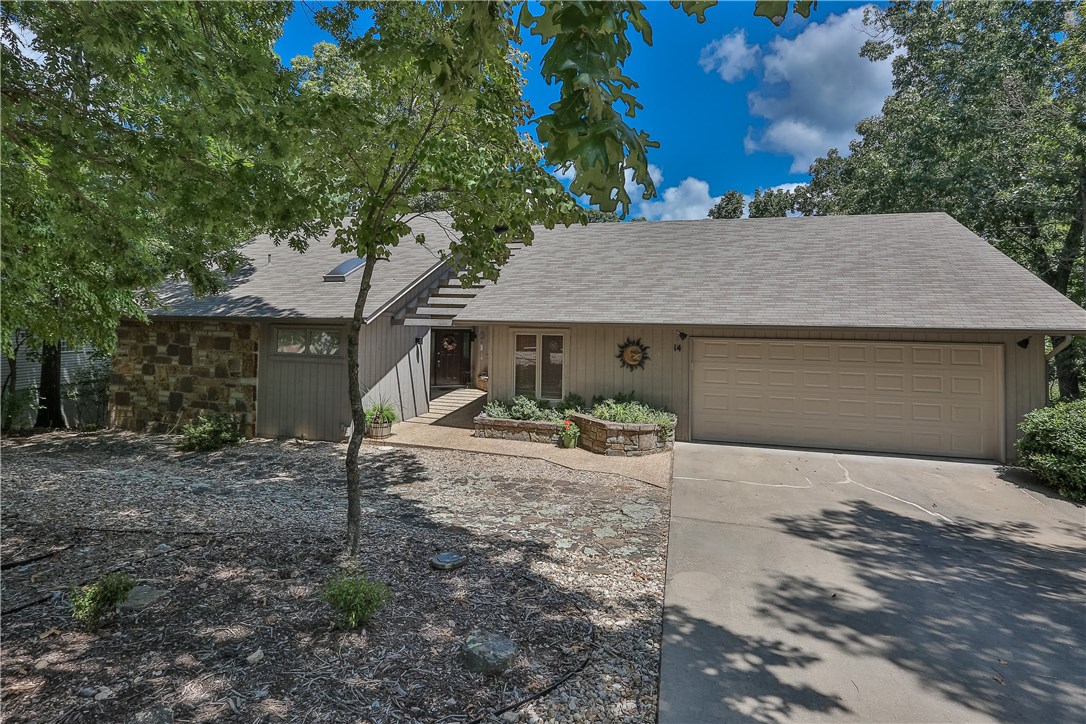 Stunning home with lots of space! This home features a great open layout. Hardwood floors, large windows and floor to ceiling stone fireplace add charm and character. Spacious living and dining areas open to the large outdoor deck, a perfect layout for entertaining. Updated kitchen with stainless appliances, granite counters and bar seating. Home office space leads to downstairs bonus space/in-law suite. Large Master suite provides the perfect retreat. Two additional bedrooms provide plenty of space. Fenced and landscaped backyard create a great outdoor entertaining space! This home is a MUST SEE!