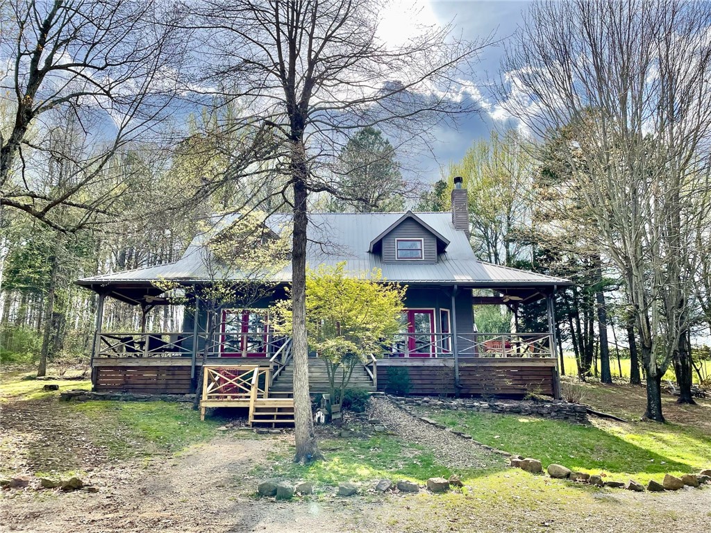The Buffalo River Farmhouse is currently a successful nightly rental and is being sold turn key and fully furnished. With one of the premier locations in the area being only 2 miles to Kyleās Landing on the Buffalo River, 2 1/2 miles from the mountain biking trails and rock climbing area of Horseshoe Canyon, this home is perfect for anyone seeking a place that is in the middle of all the Buffalo River Wilderness area has to offer. Just a 10 minute drive to Jasper to the East and a 15 minute drive to Ponca to the West. The home is located on over 5 acres & is set back in the woods overlooking a pond with large front and back porches. The 3 large bedrooms each feel like suites. The kitchen was renovated with hickory cabinets and walnut butcher blocks that add to the rustic charm. A new dual-fuel HVAC system was installed in 2022 and new LPV floors added in 2024. The front porch is wired for a hot tub but does not have one.