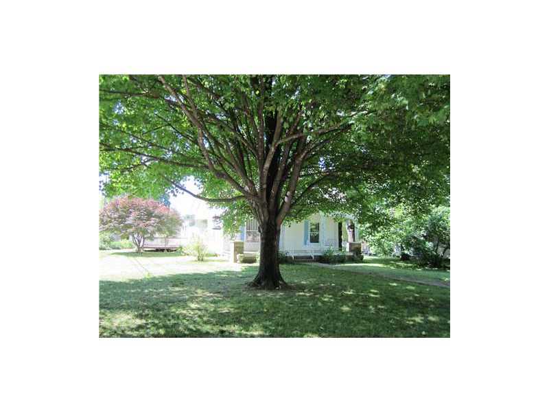 CHARMING HISTORIC HOME. LIVING RM W/ROCK FIREPLACE W/INSERT & BLOWER.BIG DINING ROOM WITH BAY WINDOW. EXTRA LG. KITCHEN W/ISLAND SINK,PANTRY, EATING SPACE. GARAGE WORKSHOP & XTRA STG. CARPET 2 YEARS OLD.COVERED FRONT PORCH W SWING. BATHS REMODELED.