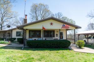 Recently remodeled farmhouse on 18 acres M/L of pasture. Many outbuildings including a large barn with three horse stalls, a metal shop building, a 3 car detached garage, and a shed for storing yard tools. Outbuildings have electricity, and the barn also has water. This property has a spring fed stocked pond, and a year round creek running through it. New fences all around. The house includes a big, open living room area with a wood burning fireplace. The large master suite opens onto a covered, screened in porch. The kitchen boasts brand new matching appliances and custom cabinets. All of this is just minutes from Bull Shoals Lake, and the White River! The possibilities here are endless. You don't want to miss out on this one! Call today to schedule your showing!