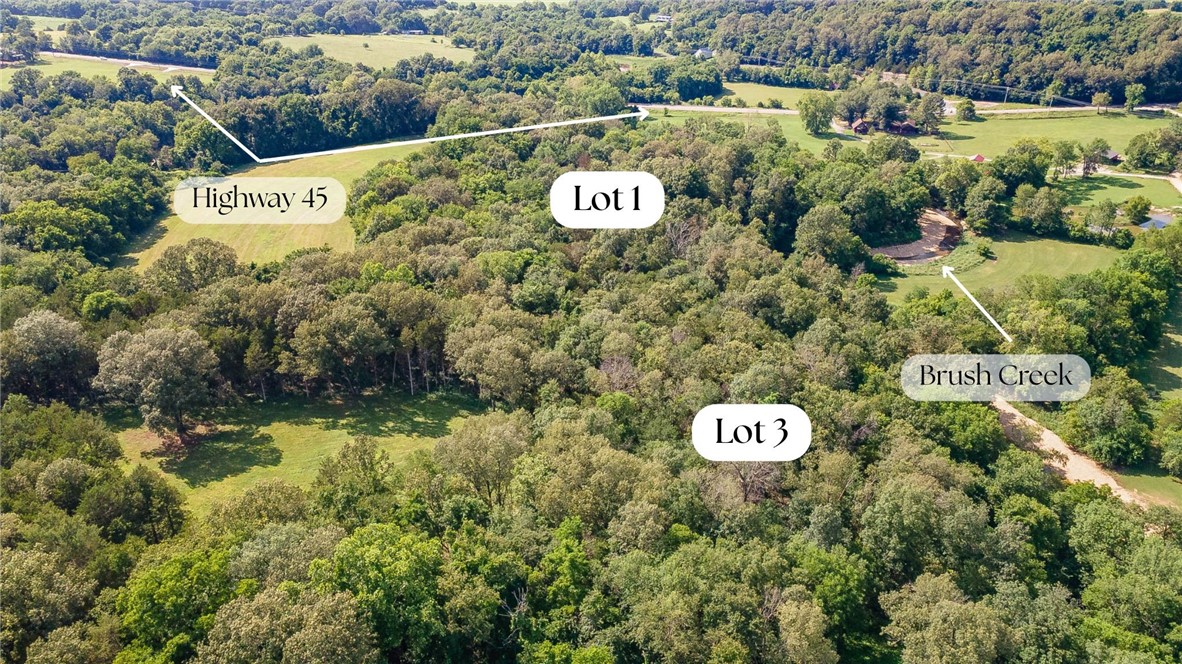 Looking for the MECCA of building sites? This is IT! 15.77 acres of rolling hills, mature trees, running water, ~1,500 feet of creek beds, swimming holes, flat pasture like land for building sites, and side by side trails. You don’t have to take your pick; you can have it all!! This property is located 15 minutes from the intersection of Crossover and Mission in East Fayetteville. It is even zoned for Fayetteville Schools!