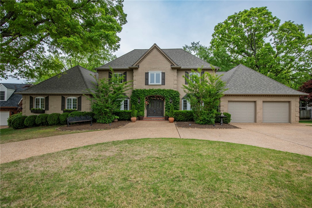 RARE FIND in the highly sought after neighborhood of El Contento Acres, perfectly situated near the Bentonville Square, Coler Mountain Bike Reserve, Applegate Trail, Walmart Home Office and Future Campus, and much more. This charming 3,900 sqft home is mostly original and sits on a half-acre lot. Cozy primary suite complete with a fireplace and 125 sqft screened in porch. Oversized utility room, which can also double as a flex space. Spacious back deck overlooking a canopy of trees. Home also provides your family with two living areas, dedicated office space, 3 bedrooms upstairs with 2 full baths, and a 3 car / tandem garage. Recent updates include: new ovens and hot water heater in 2025, new roof and guttering with leaf guards in 2024, new garage doors and lifts in 2021, new HVAC units in 2015.