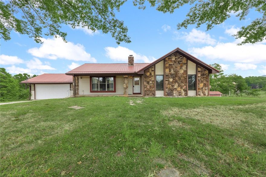 Enjoy country living just minutes from town! This 3-bedroom home with a bonus room sits on 8.77 beautiful acres along a paved road. The setting offers distant views, gentle rolling land, and plenty of space for outdoor enjoyment. The home features a metal roof, vinyl siding, and great bones, ready for your personal updates to make it your own. Properties like this, with acreage this close to town and easy access on pavement, are hard to find.