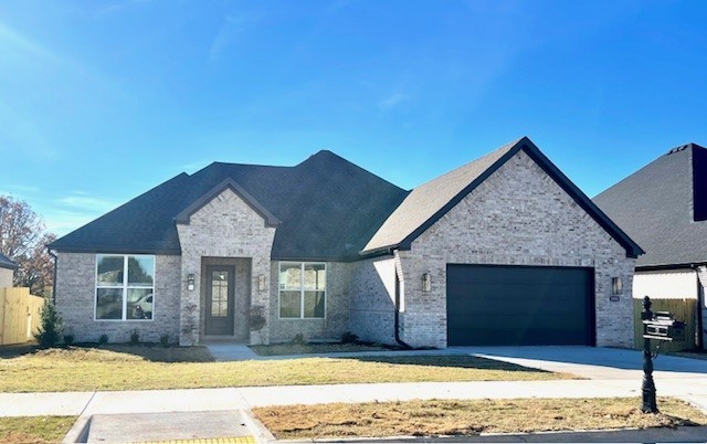 Princeton 3 Plan in Henderson Park, our newest Community located in Fayetteville! These homes will be 4-sided Brick. The Kitchen will have an oversized kitchen island, quartz countertops and 42-inch upper cabinets with top molding with an Upgraded Stainless steel appliance package. The Living room will have a Beautiful Gas Fireplace. LED lighting throughout! 2-inch blinds throughout! Ceiling fans! High efficiency air conditioner system with Programmable WI-FI thermostat! Tankless hot water heater! Bedroom one will have double sinks, oversized walk in shower, and a SOAKING TUB!! Covered Patio! Gutters included! Springdale Schools. Taxes TBD.