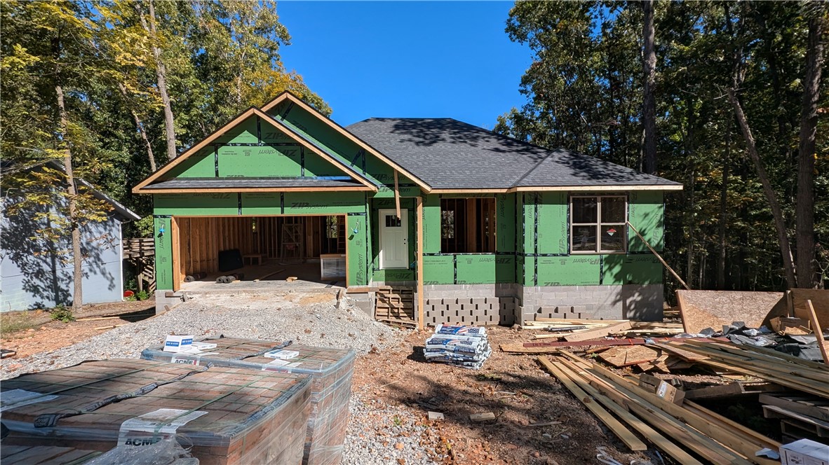 Welcome To Your Next Home! This One Checks All The Boxes ā And Then Some. Covered Front Porch, Covered Back Patio, Brick Front, Sodded Yard, And An Upgraded Moisture Barrier So You Know Itās Built Right. Inside Youāll Find A Smart Split Floorplan With 9-Foot Ceilings, A Vaulted Living Room With Beam Accents That Opens Everything Up, And A Kitchen That Just Works ā Custom Cabinets, Granite Counters, Tile Backsplash, Bar-Top Island, Pantry, And A Dining Area. The Primary Suite Has A Tile Shower, Dual Vanity, And A Walk-In Closet In Primary Bath. Bentonville Schools, Easy Access To 71B, And Literally Surrounded By MTB Trails ā Itās The Perfect Mix Of Style And Location. Rates As Low As 4.875%! Ready Mid-January, And Thereās Still Time To Make Some Selections. This Oneās A Solid Win All The Way Around.