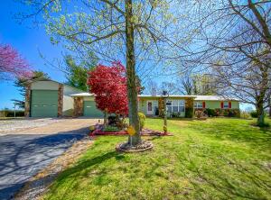 This is a true ''home'' and it won't last long. A picturesque setting on one of the most desirable paved roads in the county. Features a 1952 S.F 3 bed (could be 4) 2 bath neat as-a-pin home with a large kitchen, dining and living area, sun porch, an RV garage and garden garage in addition to the attached 2-car garage all matching the exterior of the home. Also features a storm shelter, workshop and well house. This will make a restful, peaceful hobby farm or a place for a few horses.