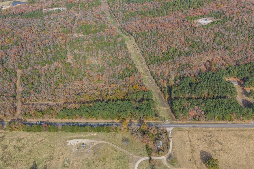 Imagine waking up to the sounds of nature and ending your evenings around a campfire beneath the stars. This 20.42-acre property consists of four combined wooded tracts offering space to build a forever home, create a private retreat, enjoy hunting and ATV adventures, or invest in land in the River Valley. Located just off Highway 23 North, the property offers convenient access while surrounded by natural scenery and towering trees. Multiple potential building sites provide flexibility for future plans. Property includes an old light pole, previous water meter location, and older concrete block foundation. Seller does not know condition of these items. Tract 4 contains a Diamond Pipeline 50-foot easement with certain restrictions. Buyers encouraged to perform due diligence regarding utilities, inspections, and intended use. Minutes from Booneville City Lake, Cherokee Golf Course, Arkansas River access, Blue Mountain Lake, Cove Lake, Altus wineries, and MJ’s Bar & Grill. MLS#1348888 & MLS#1348880 for split tracks.