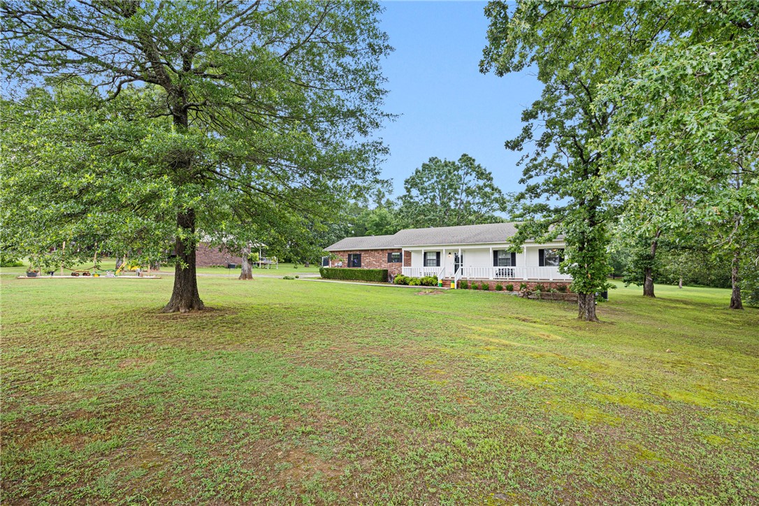 Enjoy the peace and privacy of country living at 10 N Game Cove in Pottsville. This charming home sits on approx. 1.6 acres (m/l) and backs directly up to the Wildlife Management Areaāperfect for nature lovers or outdoor enthusiasts. A spacious pole barn offers room for hobbies, storage, or equipment. Inside, youāll find neutral colors throughout, creating a warm and inviting space thatās move-in ready. Take in the easy flow of the floor plan, then step out the backdoor to a covered patio overlooking the large backyard. You'll love the peace of mind you have knowing there's a spacious safe room just off the laundry areaāperfect for those stormy seasons we occasionally experience here in the heart of the River Valley. A rare find with land, privacy, and functionality in one!