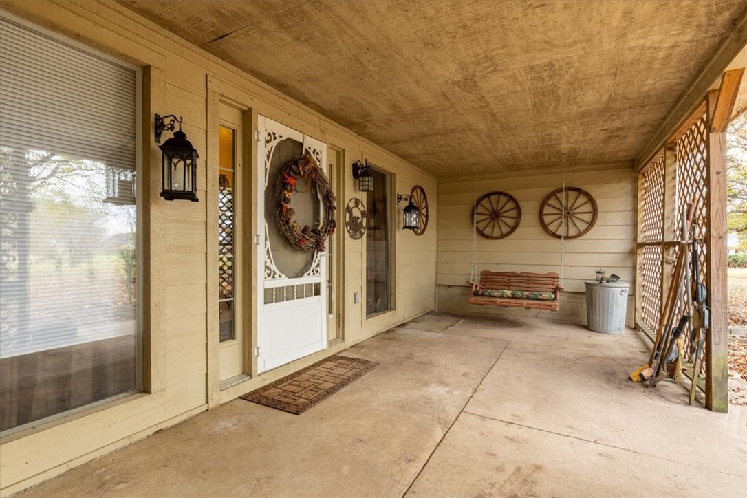 Nestled in the mature tree sits a sprawling Western style home with 4 bed 2 bath (primary with walk in bath.) 2.16 acres right on the edge of Pea Ridge. 30x40 shop with two double doors. Flowers galore!
Huge, screened room with concrete patio. Private but close.