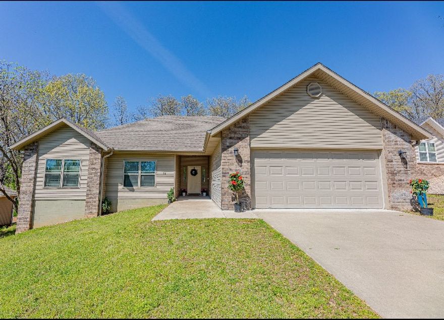 This immaculate home offers modern living at its finest. Newly constructed in 2019. Step inside to discover an inviting open floor plan, highlighted by a spacious living room boasting a soaring vaulted ceiling. The well-appointed kitchen features sleek stainless appliances, including desirable propane range and oven-a dream for any home chef.
The home flows beautifully with engineered floors and carpet in bedrooms. Enjoy the privacy of a split floor plan, featuring two full-size bathrooms with a tub.
Extend your living outdoors to the expansive covered deck, an ideal spot for relaxation or entertaining while overlooking the large private backyard and tranquil wooded area. Benefit from public sewer, Bentonville school district, and easy access to the highway for effortless commuting. This gem won't last long.