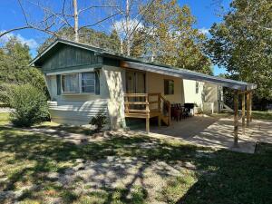 Channel your inner Marty McFly and step into a time capsule of 1980s nostalgia just a stone's throw away from the lake in Diamond City. This place comes fully furnished with your grandma's decor, which is as retro as a Rubik's Cube, and it's sure to make you smile like a Care Bear. This 2-bedroom, 1-bath manufactured home is not just a house; it's a journey back to the days of acid-washed jeans, cassette tapes, and totally tubular style. Imagine waking up in a bedroom that could rival the set of an '80s music video. The bathroom, a shrine to retro chic, boasts vintage vinyl that is practically an art form. It's like stepping into a living, breathing time machine--complete with a soundtrack of synthesizers in the background.