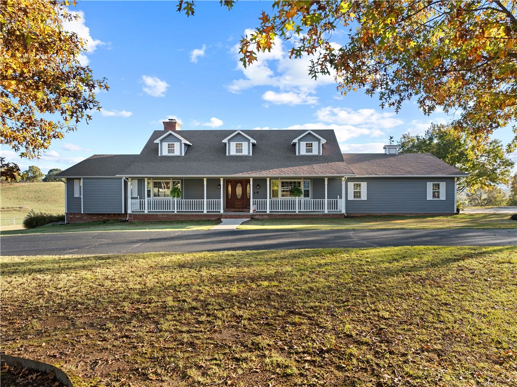 This stunning executive-style home in Harrison, AR, near the Buffalo National River and just 30 minutes to Branson, MO, offers luxury housing 5 picturesque acres. The chef's dream kitchen features granite counters, Frigidaire commercial-style stainless steel appliances, a gas range, wall oven, and custom cabinets with smart features for seamless meal prep. With 6 bedrooms and 5.5 baths. The home is ideal for multigenerational living, including a second full kitchen, 2 bedrooms, and 2 baths in the basement with ensuite baths. Two wood-burning fireplaces, one ducted into the HVAC system for added winter energy efficiency. Enjoy sunsets over the Ozark Mountains from the deck, and raise livestock on the 5 acres. You can store your RV in the red barn with 14-ft. doors for direct pass through. Located just outside the city limits, this home is only 2 minutes from the Creekside Regional Community Center, making it a perfect blend of rural serenity and modern convenience.