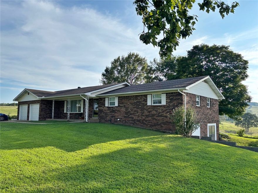 Check out this Fantastic 1 1/2 acre m/l Ozark Hobby Farm which is turn key and ready for your chickens, horse or cow and garden. Neat 3BR, 2 BA brick home features a living room with beamed cathedral ceiling and large gas log fireplace, spacious kitchen/dining area, large utility room and lots of room in partial basement for more living space or storage. The barn has three separate areas and is good for storage, animals, etc. Pretty views from the covered deck and front porch. Fronts county road 10 miles from Harps grocery and only 20 minutes into Harrison. Within an hour of Table Rock, Taneycomo, Bull Shoals & Norfork Lakes, the Buffalo, White & Norfork Rivers and Branson, MO. Crooked & Clear Creeks are just minutes away. Come and explore all the Ozarks has to offer with multiple canoeing, kayaking, swimming, fishing, hunting, hiking, camping and sight seeing opportunities! Advertised square footage includes some partially finished area in the basement. All #'s are approximate.