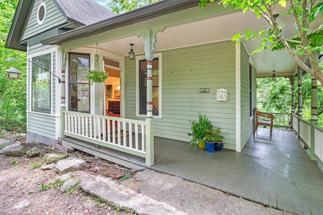 Historic Character Meets Investment Potential. This property is more than just a timeless treasure; itās an incredible opportunity! Whether you're looking for a multi-family residence or a long-term rental, this property offers flexibility and income potential. Originally built in 1897 and fully renovated in 2010, located a very short distance from the vibrant downtown. So much love and dedication went into the renovation! Stunning architectural details aboundāFrench doors, windows with original wavy glass, rich pine floors, and high ceilingsācreating an atmosphere of charm at every turn. Separate lower level living space with its own kitchen and separate electric meter, making it ideal for multi-family living or rental income. Perfect for a homeowner seeking to reside on one level while leasing the other, offering both privacy and financial benefits. Wraparound porches, on both levels, delivering picturesque views and a serene setting. You can feel the warmth and soul of this home the moment you open the door!