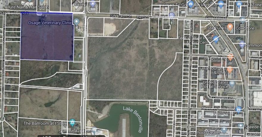 Prime location with major frontage along heavily traveled Hwy 102 West/SW 14th Street near Bentonville Municipal Airport, Climb, & new Bentonville Brewing Company & directly across highway from Aldi. 5 minute drive to downtown Bentonville. 23.43 acres +/- with home, well house, & barn.  City sewer across 102 and sewer hook-up on I Street or Mayflower Road. Commercial or mixed-use development potential. Farmhouse & barn will be sold AS-IS.  Structures are tear down.
