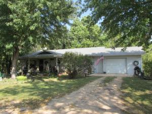 Near Bull Shoals lake, brick and frame home, full basement mostly finished and roughed in for 2nd kitchen, unfinished bsmt extends under part of garage. Detached 30 x 36 ft brick & frame shop building with extra concrete area for outside parking. Garden spot, fruit trees, land part pasture and part wooded. Land fronts CR 2059 and lays to left of driveway to house, house sits at back of the land not visible from CR 2059. This property is under Freddie Mac First Look Initiative thru 6/13 for owner occupants only. Seller requires pre-qual letter from lender with contract. Repairs needed, sold As Is, loan type must accept As Is condition, see Inspections in Documents. Age, sq ftg, lot size, acreage, etc, are from public records, Buyer should verify.