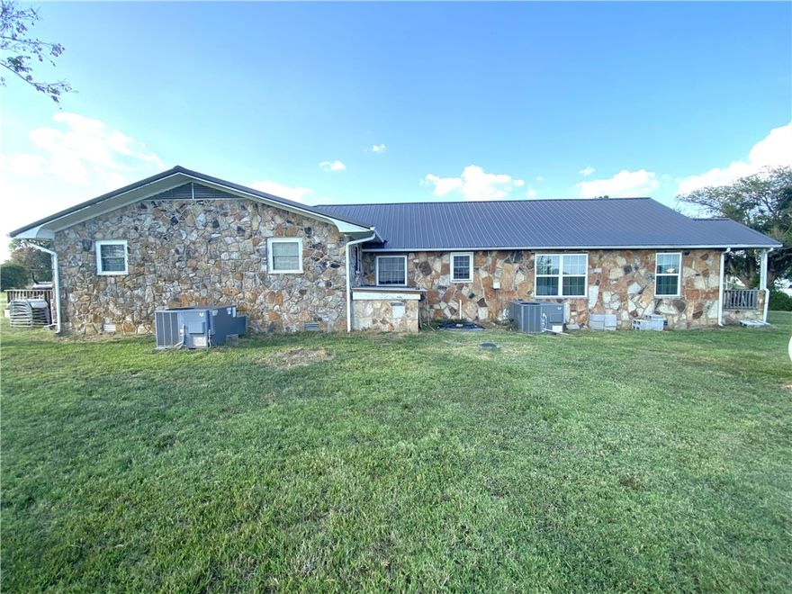 This 2200 SF 3 Bedroom 2 Bath charming, rustic home tucked away in the rolling hills just outside Harrison, AR. Set on 2.77 acres of mature landscaping and offering serene country-style living, this property blends comfort, character, and opportunity. Two large rooms for furniture, game or family rooms. Two full bathrooms—plenty of space for family, guests, or potential rental income. The 2.77 acres provides privacy, room for a garden, additional outbuildings, or outdoor enjoying. Quiet, country feel: If you’re seeking a peaceful pace, Cowan Loop offers a tranquil setting away from the noisy city but still close enough to Harrison for conveniences. The large lot gives space to expand. Outbuilding provides a workshop area, or simply enjoy the open yard for gatherings, pets, or hobbies.