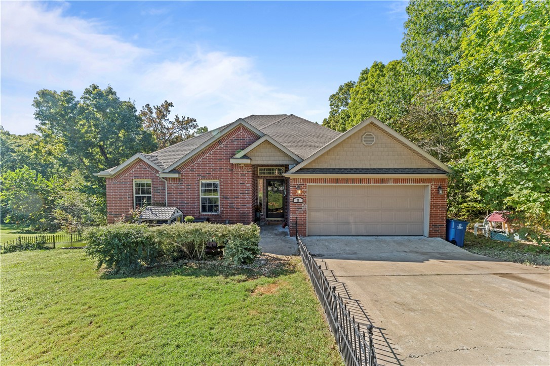 Welcome to your Northwest Arkansas retreat! Perfectly positioned with riding access to the brand-new Oz Bike Park, this inviting Bella Vista home offers the best of outdoor adventure and everyday convenience.
Featuring a split floor plan, the home is filled with natural light and offers both comfort and privacy. Just steps from your driveway you’ll find direct trail access to Down Under, making this property a dream come true for mountain bikers, hikers, and nature lovers. Enjoy the peaceful surroundings from two spacious decks, ideal for morning coffee, evening gatherings, or simply taking in the wooded views. The gently sloping yard provides usable outdoor space while maintaining a natural setting. Located in a prime spot, you’ll appreciate quick access to shopping, dining, and I-49, allowing you to easily connect to all that Northwest Arkansas has to offer while still enjoying the quiet charm of Bella Vista.