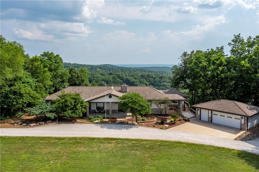 Comes furnished with accepted offer. Executive custom home with 3-stall horse barn, green pastures, and room to roam. Built to energy-efficiency standards, walls, windows and roof overhangs to prevent direct sunlight in the summer and allow more light in during winter months. Year round beautiful lake view, Breathtaking valley views. The kitchen is one you could spend all day in. Vented gas cook-top, double ovens, butlers pantry. Hot water re-circulation, sound system, generator, 2 safe rooms. Large rooms, spacious closets, elegant built-ins, two fireplaces. Master suites on each level. Seating areas spaced out for entertaining. Remote-controlled sun-shades for the wall of windows in the upper level. Several outdoor and screened-in areas for group gatherings and huge parties.
Deck replaced and extended,New Gutters,New Exterior Paint,RV Carport with 50amp and dump station, New tile in sun-room and a Security system. 
1,500 Gallons of propane storage.New Roof - 2019, 2 New HVAC - 2021,New appliances - 2022