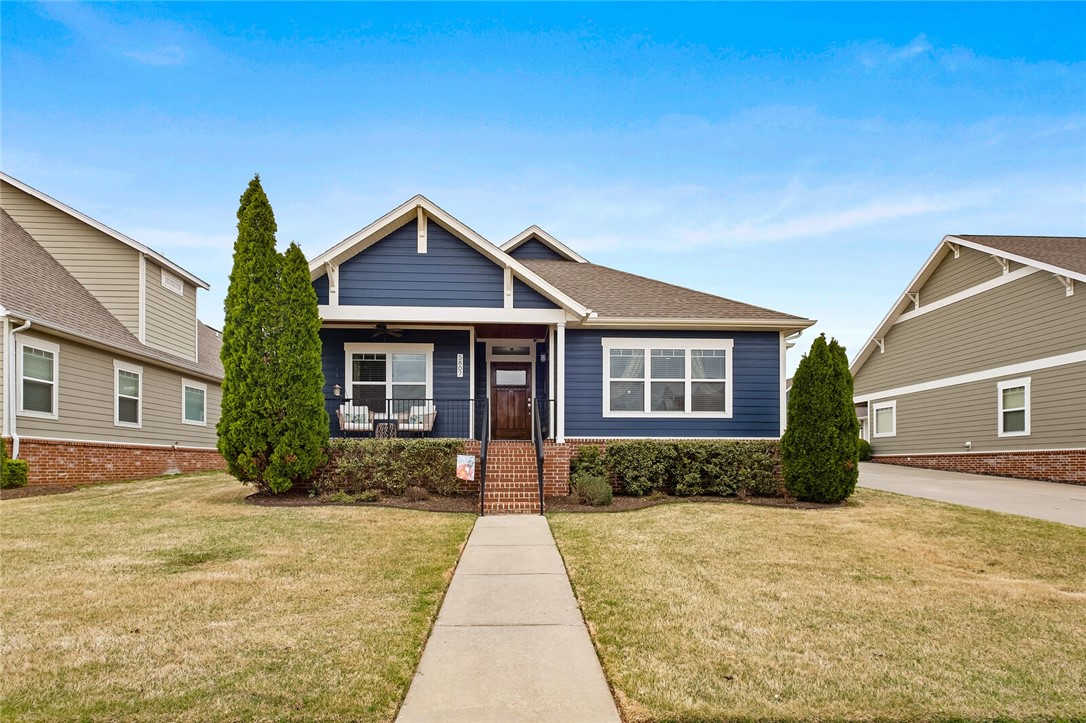 Immaculately maintained Craftsman-style home in highly sought-after S/D. Cycling enthusiasts will enjoy the trailhead moments away. This charmer has fantastic curb appeal and boasts an inviting front porch overlooking redesigned flower beds. As you enter the home, youāll be dazzled with gorgeous hardwood flooring throughout, an open concept that flows perfectly for entertaining, an abundance of natural light, and a split floorplan. The kitchen showcases granite countertops, beautiful cabinetry, S/S appliances, and an entrance to a side covered patio. There is ample room for a sitting area in the oversized Primary Suite. Significant upgrades include fresh interior & exterior paint, additional attic insulation, replacement of two sides of privacy fence and a gate, new kitchen plumbing & light fixtures, and a dishwasher. The home consists of 2,048 SF (measured by appraiser), 3 BRās, 2 BAās, a security system, sprinkler system, and lawn is maintained professionally. Donāt miss the opportunity to claim this treasure.