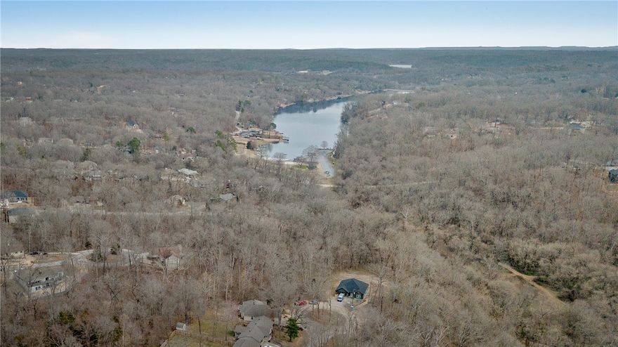 Welcome to 7 Aycock Lane in Bella Vista, a prime location just across the street from the Lago Vista bike trail. This functional home offers instant access to outdoor recreation. It boasts fresh updates, including brand new carpet and appliances, making it move-in ready. Enjoy the tranquility of the setting while still being close to Bella Vista’s lakes, golf courses, and trail system. With an easy drive to Bentonville and Rogers, this is an excellent opportunity for full-time living, a weekend retreat, or an investment in a highly desirable area.