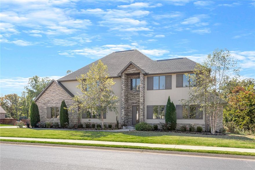 Modern, Luxury, Estate nestled on 1.48 acres with a very private, serene, wooded view in one of NWA’s premier neighborhoods, Estates of Oak Tree. This 5 bdrm home, all en-suites, w/ a 2nd bdrm on main level, also boasts an open kitchen, living room, dining room, all perfect for entertaining, as well as, a bar/media room w/garage door that opens up to pool/hot tub & covered patio complete w/double-sided fireplace & built-in grill perfect for relaxing after working all day in the home office. Wanting to escape? Retreat to the very, private master suite/bath, upstairs to one of the 3 spare bdrms plus bonus or burn it off in the home gym. This is one home that has it all…you never have to leave!