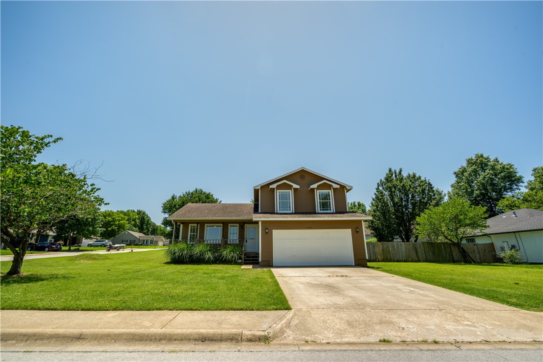 Welcome to your new Fayetteville home! Only minutes from the University of Arkansas and downtown Fayetteville, this gem is situated on a spacious corner lot with fenced back yard. Entertain effortlessly with this thoughtful floor plan featuring a large living room, open kitchen and dining area, and a second sunken living room downstairs with a lovely wood-burning fireplace. This home is well maintained and move in ready with a fridge, washer, and dryer to convey. Close to local schools, parks, and trails, you'll enjoy everything Fayetteville has to offer from this charming home. Book your showing today!