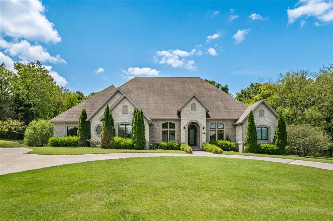Welcome to your private retreat in The Knolls Subdivision—where elegance, space and comfort meet in this one-owner custom home. Nestled on 2.02 acres, this 4-bedroom, 3.5-bath offers thoughtfully designed living spaces, ideal for both everyday living and entertaining. Split floorplan boasts of large living areas both inside and out. Huge covered patio with fireplace overlooks the inground pool and private backyard oasis or step out the primary bedroom to your patio prewired for hot tub for personal spa time. Kitchen ready for hosting large gatherings with oversized island, gas cooktop, pantry and coffee station. Office makes those quick work from home days productive or spend time on projects in the shop with wash sink. The 2+2 garage gives you space for all your pool toys or hobbies and the generator adds extra security for anything that may happen. Whether you're cooking gourmet meals, hosting summer gatherings by the pool or enjoying quiet evenings under the patio, this home delivers the lifestyle you dream of.