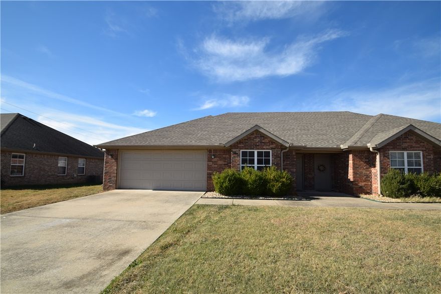 Updated with fresh paint, flooring, and appliances.  This 3 bedroom, 2 bath, 2 car garage duplex has open layout and private back yard with privacy fence. Home has vinyl flooring, stainless appliances and refrigerator, washer and dryer.