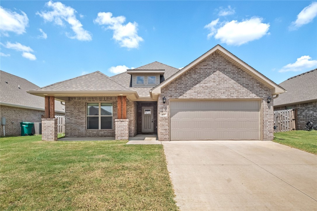 Here is one of the coolest and most functional floorplans you will find and your family will love it!. As you enter you are greeted by wood look tile throughout all the living areas. An immediate left takes you to your kids bedrooms who will also have a bathroom to share between the two rooms. From there you venture on to the open kitchen with a big pantry, modern white cabinets, white subway tiles, black granite and gloss black appliances, including the refrigerator, really make this kitchen pop. The kitchen looks on to the expansive living room with a corner fireplace. The primary sits at the back of the home and has an ensuite with dual vanities, tile shower and soaker tub. The huge walk-in-closet connects to the laundry room for ease of putting away laundry, washer and dryer convey, a very cool feature. Outback you can relax under the covered back porch and watch the kids and dogs play in the flat, fenced backyard with a double gate. This home is conveniently located and ready for your family to love it.