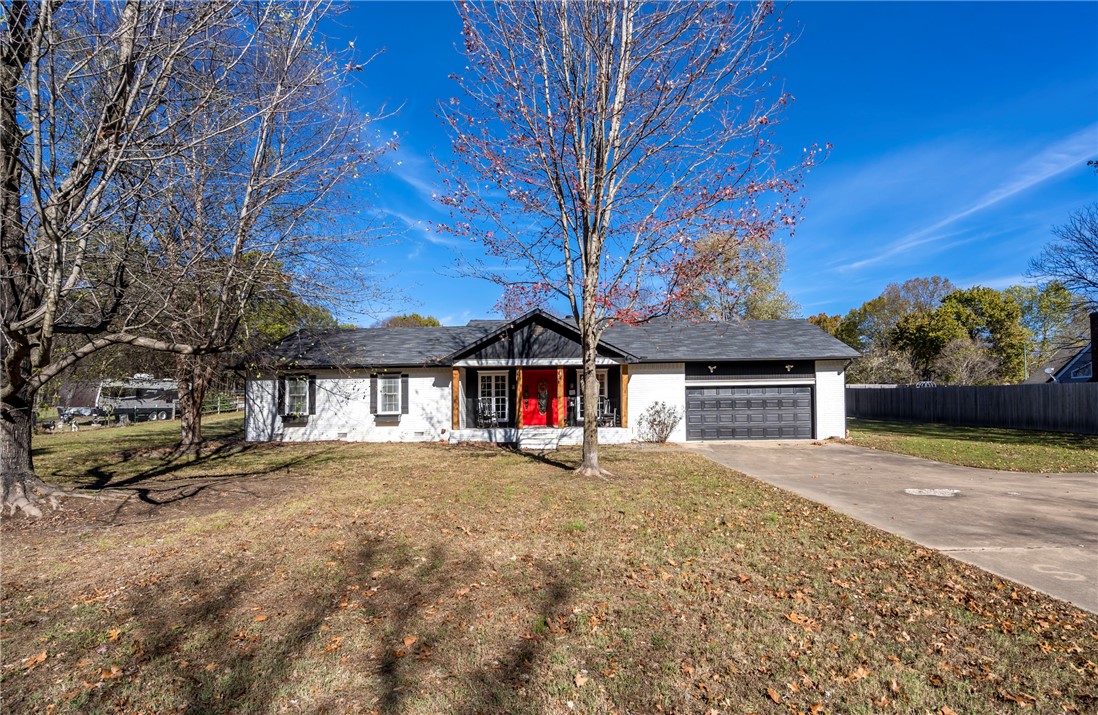 Nice 1987 sqft 3 bedroom 2 bath home with 2 living areas and great 1+ acre lot in a great neighborhood! JBU Mountain biking trails across the street! Really nice peaceful area of Siloam Springs!