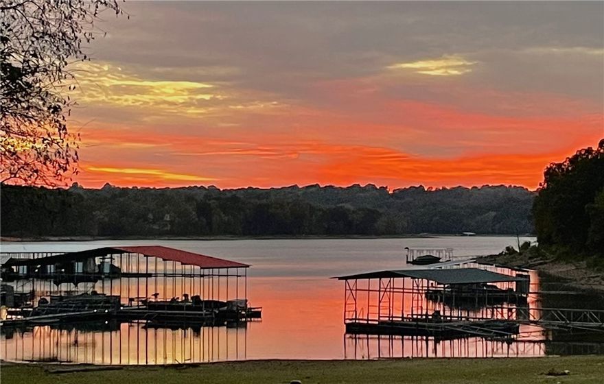 Picturesque Expansive LAKE VIEWS from Every Window of this Beaver LAKEFRONT Home w Private BEACH. 30’ Boat Slip/Locker in Marina-grade Community Dock w Vaulted Ceilings, Concrete Floors, & 4’ wide walkways. Well-built Home w High-end Finishes & Detailwork thru-out, from Gorgeous Hardwood Floors, Double Glass Front Doors, & Arched Doorways. Spacious Rooms w/ Tall Ceilings on Main Level present a Generous Family Room w Gas Fireplace, Built-ins & Dining Room w Bar Area. Gourmet Kitchen offers beautifully grained Wood Cabinetry, Dual Ovens, 5-Gas Burner Stove, Walk-in Pantry. Primary Bedroom on Main Level flaunts those Lake Views, & Private En-Suite w Dual Sink Stations, Soaking Clawfoot Tub, & Private Bidet. 4 Car Tandem Garage for tons of parking/storage. Walkout Basement boasts Lakeviews & Huge Bonus room w Stained Concrete Flooring w Wet Bar & Mini-Fridge, as well as 2 Bedrooms & Bath. New Screened-in Porch w Composite Decking off Main Level. Sound system & Underground propane tank. Welcome Home!