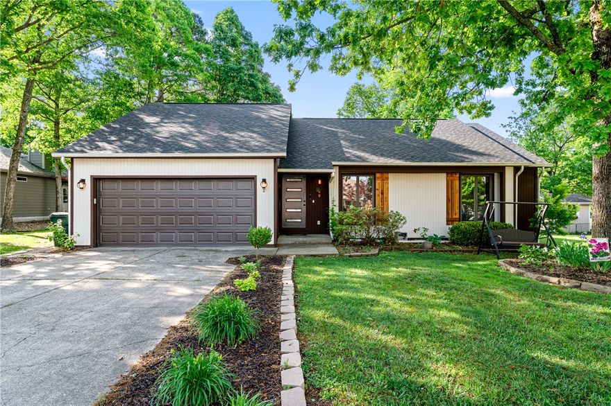 Discover comfort and charm in Holiday Island with this inviting 3-bedroom, 2-bath home designed for easy living and everyday enjoyment. Step inside to a welcoming living area that flows seamlessly into the dining space and kitchen, creating a functional layout perfect for both relaxing and entertaining. Generous counter space and ample storage make meal preparation simple and efficient. The primary suite offers a private retreat with its own bathroom, providing comfort and convenience, while the additional bedrooms offer flexibility for family, guests or a home office setup. Enjoy the peaceful surroundings outdoors with a backyard space ideal for relaxing or hosting gatherings. Located near Eureka Springs, just minutes from golf, the marina, Table Rock Lake, parks, and dining giving you the perfect blend of tranquility and recreation.