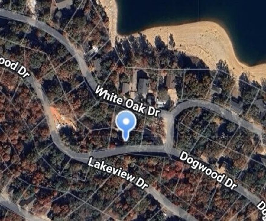This vacant lot in Lost Bridge Village offers a great opportunity for building your dream home or weekend getaway. Just a short walk to the clubhouse, boat ramp, and swimming pool, you’ll have easy access to all the amenities the community has to offer. With utilities available at the street, this lot is ready for your vision to come to life. Whether you’re looking for a quiet retreat or a place to enjoy outdoor activities, this location has everything you need.