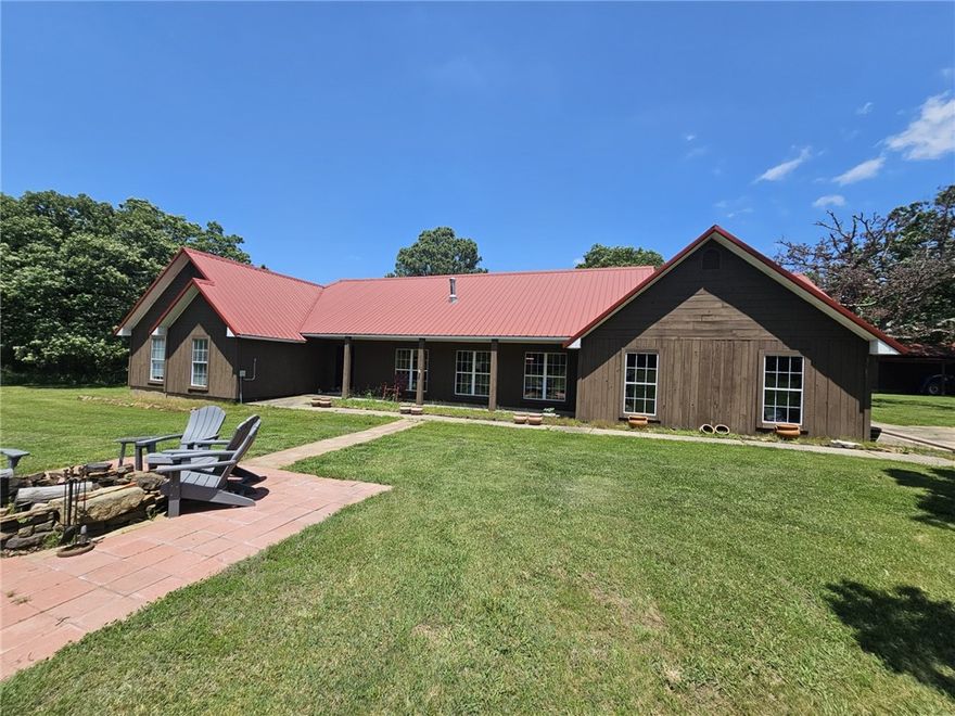 Nearly 800 acres of the Ozarks can be yours.  Just 35 minutes from downtown Fayetteville. Property features miles of trails, multiple ponds, creeks, and amazing views from over 2000 feet in elevation.  Have lunch in your private gazebo overlooking the surrounding mountains.  Main house/lodge features 4 bedrooms, 2.5 baths, and a two car garage. With approx. 2700 heated and cooled square feet, there is plenty of space for entertaining. Backyard have huge covered patio. Large workshop/barn. Second home currently has tenants that watch over the property.  Wildlife is abundant!