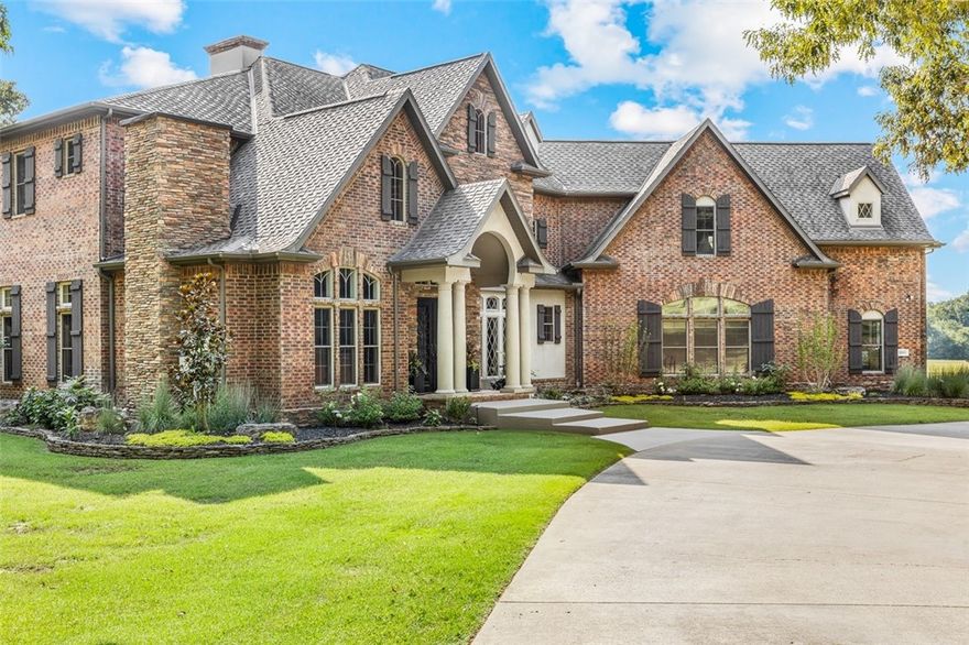 Experience one of the Ozarks' premier estates, minutes from Harrison, AR, and near the Buffalo River, Bull Shoals Lake, and Branson, MO. This 5.59-acre property features an approx. 7,500 sq ft home with 5 bedrooms, 5.5 baths, and luxury throughout: 2x6 construction, foam insulation, cathedral ceilings, three fireplaces, four HVAC units, a grand staircase, and utility rooms on each level. The master suite includes a sitting area, office, kitchenette, and spa-like bath. The gourmet kitchen has granite counters, Viking cooktop, pot filler, and pantry, plus a formal dining area. Enjoy mountain views from Andersen windows and the large composite deck. The 37’x49’ Barnmaster horse barn includes stalls, tack room, hay storage, and a wash area with hot water. Beautiful landscaping, mature trees, and fenced pastures complete this exceptional property!