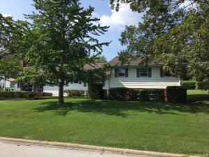 Lots of square footage nestled on a double lot. Four bedrooms two 1/2 baths with finished basement. Lots of built ins. Please overlook the contents for it is set up for a personal property auction.
