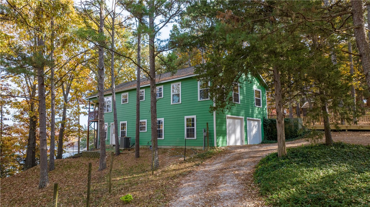 Stunning lake home with incredible views of Beaver Lake is minutes from War Eagle Marina with easy access to everything NWA has to offer. Home features an expansive covered deck overlooking your private lake view. Living room hosts a wood stove for cozy winters. Built in 2010, this home has Maple hardwood floors & cabinets, tongue and groove cedar ceilings, concrete siding, foam insulation and a hypoallergenic / antimicrobial central air filtration system. Quiet, walkable neighborhood with no HOA fees. The fenced side yard is ready for your animal friends. Come experience the natural beauty of Beaver Lake.
