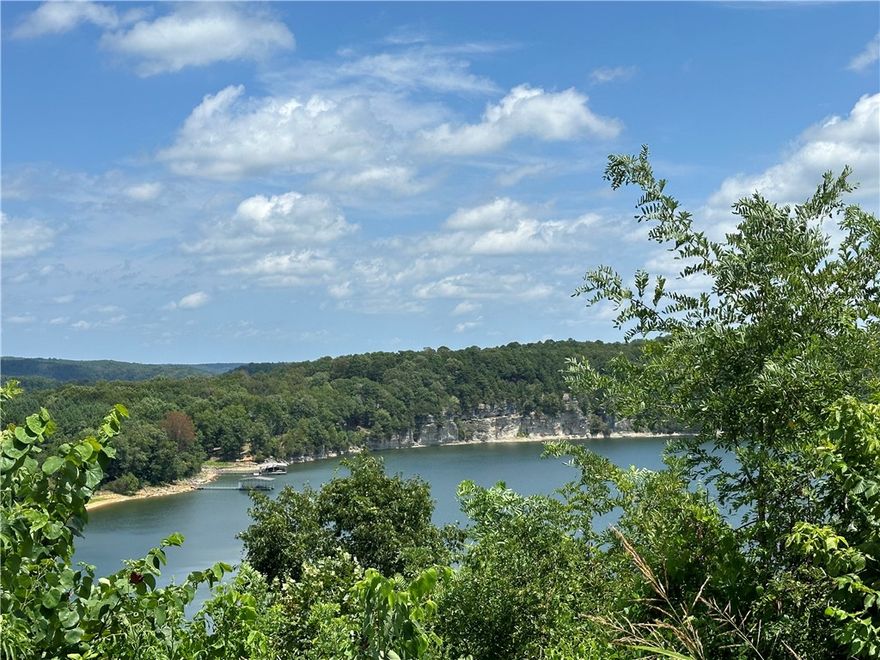 Perfect for the Vision-Minded Buyer, this lakefront lot spans nearly 2 acres with stunning views of Beaver Lake near War Eagle Marina! Ideal for a home with picture windows wall floor to ceiling to soak up the expansive view. Build a rooftop patio to extend your view of the lake, it is the perfect place for entertaining! Located in the Springdale school district, this lot is perfect for a multilevel house design. Don't miss out on this unique opportunity!  This land is about a 45* slope, that's why it's perfect for a multilevel house.