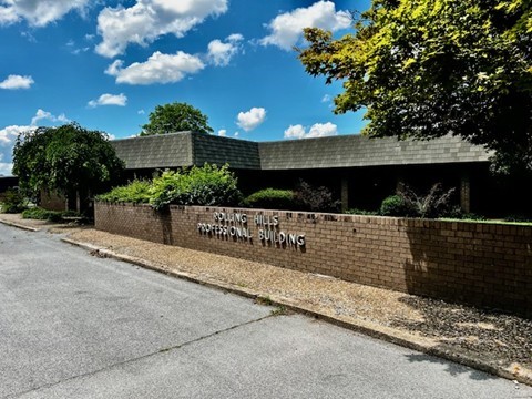 Move-in-ready professional office suite located in the heart of Fayetteville. This well-established space features 2-3 private offices, a welcoming reception area with a service window, and a dedicated waiting room. Additional highlights include: executive-style wood cabinetry with built-in shelving, a versatile break room with a kitchenette, a separate storage room/lab with counter and sink, 2 private restrooms, and access to 30+ parking spaces. With its flexible layout and affordable rent, Suite A is ideal for medical, administrative, or other professional office uses. Freshen up the space with your choice of paint, and you're ready for business.