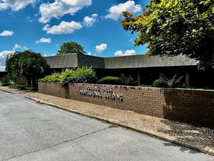 Move-in-ready professional office suite located in the heart of Fayetteville. This well-established space features 2-3 private offices, a welcoming reception area with a service window, and a dedicated waiting room. Additional highlights include: executive-style wood cabinetry with built-in shelving, a versatile break room with a kitchenette, a separate storage room/lab with counter and sink, 2 private restrooms, and access to 30+ parking spaces. With its flexible layout and affordable rent, Suite A is ideal for medical, administrative, or other professional office uses. Freshen up the space with your choice of paint, and you're ready for business.