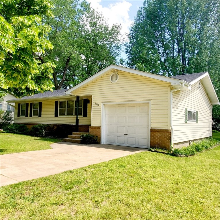 Charming home nestled in the heart of Springdale with an extra wide street and mature shade trees surrounding this gem. One home ownership with a clean, well cared for and properly maintained home... perfect for first time homeowners, retirees, or as investment property. Updates include new roof & leaf guards (2022), HVAC/Water Heater (last 5 years). Real hardwood floors in the living room, two cozy bedrooms, one bath with handrails in tub and gas heater, eat in kitchen with gas cooktop. Lot's of built in shelves in the garage/storage room, and throughout the home. Favorable sized back yard for gardening, play and entertainment, and in-ground storm cellar, rock patio, partial chain link fence, and fully landscaped. Near schools, library, water park, hospital, trails, downtown shops and restaurants. This is a must-see solid home! Blink video doorbells (front and back) and drapes convey. Agent related to seller.