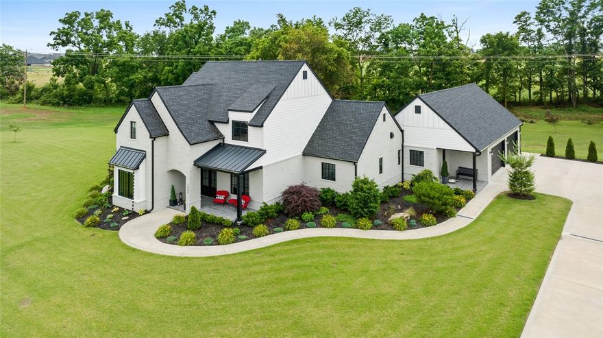 Nestled within the gated West End Acres neighborhood, this 3,969 sf residence boasts timeless architectural design & meticulous attention to detail. Upon entering, you are greeted by an elegant foyer setting the tone for a sophisticated & thoughtful design that defines the rest of this custom residence. The spacious living areas open to a beautiful four-season sunroom bathed in natural light, offering a seamless flow ideal for both intimate gatherings & lavish entertaining. The gourmet kitchen is a culinary enthusiast's dream, equipped with top-of-the-line appliances, bespoke cabinetry & separate butler’s kitchen. Retreat to the gorgeous primary suite, complete with spa-like ensuite bath & overlooking the lush landscape. The noteworthy laundry room & mudroom feature custom cabinetry, built in pet crates and locker cabinetry. Outside, the serene surroundings provide a private oasis w/covered veranda & pergola patio featuring grilling kitchen and stone fireplace- perfect for alfresco dining, relaxing & entertaining.