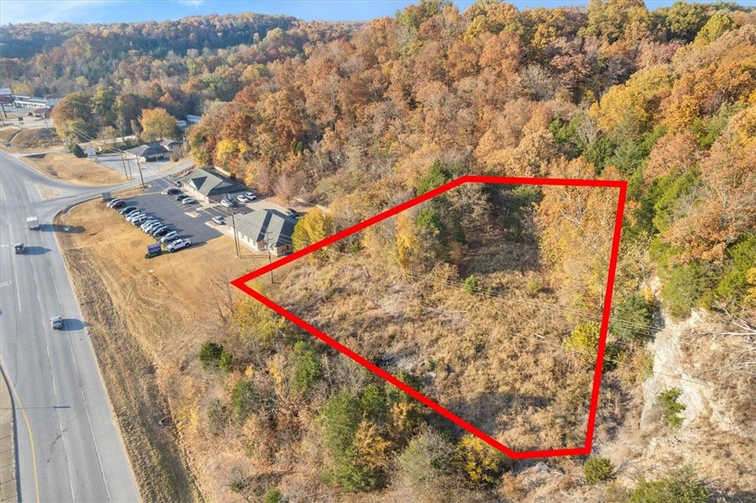 Highway Frontage in Bella Vista. Last piece of commercial land on Bella Vista Way/Hwy 71 ready for you to build your dream business as Bella Vista grows and changes with our amazing area. This almost one acre lot has PRIME visibility and easy access. Quite a few extras come along with this opportunity. Across the street from Allens Grocery store as well as surrounded my new businesses coming to Bella Vista!!!