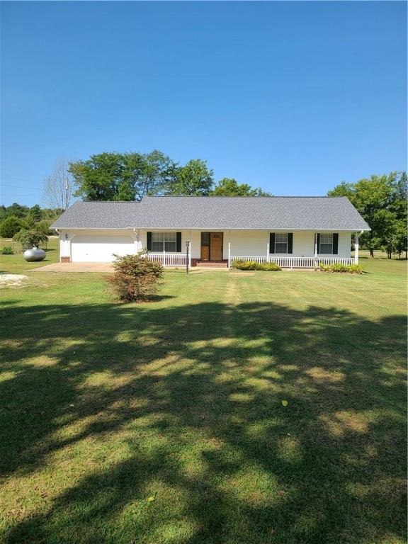 Spacious 3.61 acres surrounded by beautiful shade trees. Lovely 3 BR/2 BA home has a great country setting and is just minutes from town. Newly remodeled with a new roof, new flooring, paint, granite countertops and fixtures.
