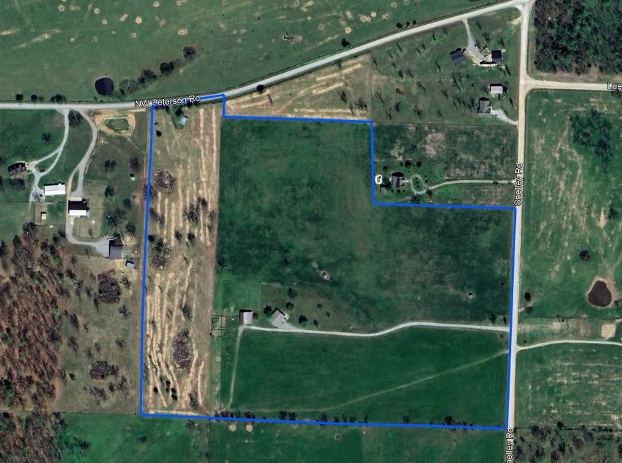 Located just minutes from town, this 43.55-acre property offers the perfect blend of open space and convenience. With extensive road frontage and easy access to major routes, it presents a prime development opportunity for those looking to subdivide, build additional residences, or establish a private estate close to town. The land is fully fenced and ideal for livestock, farming, or simply enjoying the peaceful rural setting. A spacious 2,400 sq ft 4-bedroom, 2-bath home features two kitchens and a flexible layout, allowing it to be easily divided into two separate living spaces—perfect for multi-generational living or generating rental income. A large barn provides ample storage or workspace. Whether you're seeking a hobby farm, an income-producing investment, or the ideal location to create your own private estate, this versatile property offers endless potential with its strategic location, development flexibility, and natural beauty.