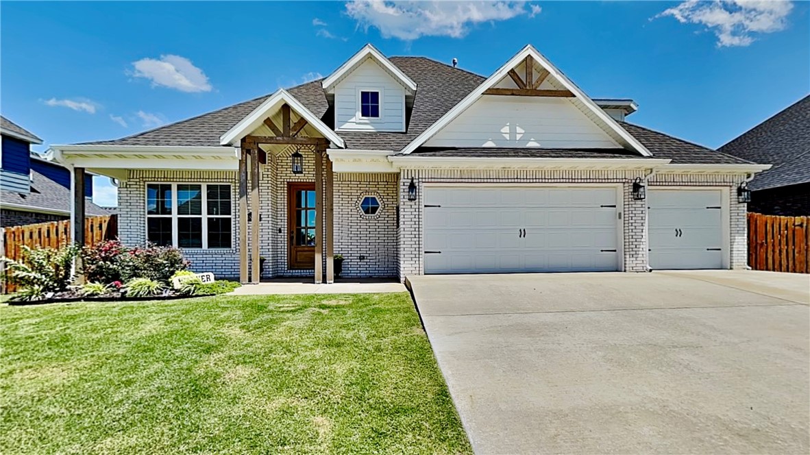 Welcome to this stunning 4-bed, 2.5-bath home in the heart of Pea Ridge. With 2,485 sqft this house offers an open layout, perfect for modern living. Step inside to a large entry with a built-in bench, leading to an airy living room. The open kitchen is a chef's dream, featuring a generous island, huge hidden pantry, and soft-close cabinets. Enjoy luxurious touches like granite countertops, shiplap accents, and beautiful new wood look tile and carpet. This home boasts a cozy gas log fireplace and abundant storage with walk-in closets. Beyond, a covered patio and pergola extends your living space, ideal for unwinding in your private hot tub (only 2 years old). Plus, enjoy energy efficiency and savings thanks to the solar panels! With a 3-car attached garage and a durable brick exterior, this property combines convenience with classic appeal. An attractive storage building ensures you have room for all of your toys! View the virtual tour and walk the property from your computer then make an appt to see it in person!